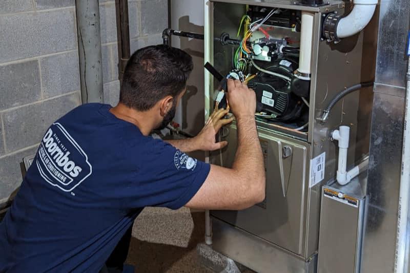 a mechanic fixing furnace pittsburgh